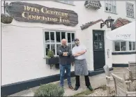  ?? ?? COACHING INN: Paul Binnington, left, and Paul Murphy outside the Crown Inn at Roecliffe, near Boroughbri­dge in North Yorkshire.