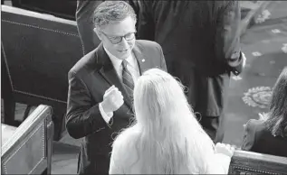  ?? SPEAKER Jacquelyn Martin Associated Press ?? Mike Johnson talking to Rep. Marjorie Taylor Greene on the House f loor this month.