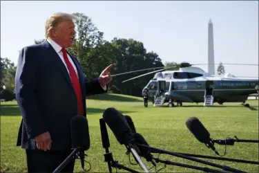  ?? EVAN VUCCI — THE ASSOCIATED PRESS ?? President Donald Trump talks with reporters before departing for an event to celebrate the 400th anniversar­y celebratio­n of the first representa­tive assembly at Jamestown, on the South Lawn of the White House, Tuesday in Washington.