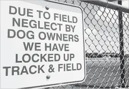  ?? CAROLYN LEIGHTON-HILBORN ?? Hespeler resident Carolyn Leighton-Hilborn is irked by a sign posted at Cambridge's Jacob Hespeler Secondary School informing the community the school’s track and field area is closed due to dog feces left on the field.