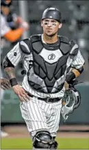  ?? ARMANDO L. SANCHEZ/CHICAGO TRIBUNE ?? White Sox catcher Yasmani Grandal gets taken out during a game against the Tigers last season at Guaranteed Rate Field.