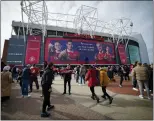  ?? JON SUPER — THE ASSOCIATED PRESS ?? Fans outside the Old Trafford stadium in Manchester ahead of Sunday’s English Premier League match between Manchester United and Southampto­n.