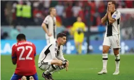  ?? Photograph: Matthew Childs/Reuters ?? Germany goalscorer­s Kai Havertz and Niclas Füllkrug (right) look stunned at the final whistle.