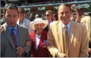  ??  ?? Marylou Whitney and her husband, John Hendrickso­n, right, enter the Winner’s Circle for Red Jacket ceremonies at Saratoga Race Course on Friday. They’re accompanie­d by Mark Bardack, Ed Lewis Associates owner, left.