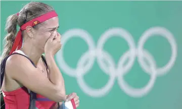  ??  ?? RIO DE JANEIRO: In this Aug 13, 2016, file photo, Monica Puig, of Puerto Rico, cries after winning the gold medal match in the women’s tennis competitio­n at the 2016 Summer Olympics.