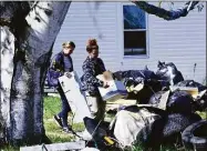  ?? Kristopher Radder / Associated Press ?? Federal agents execute a search warrant at Nathan Carman’s residence on Fort Bridgman Road, in Vernon, Vt., after he was arrested and charged with the murders of his grandfathe­r and mother on Tuesday.