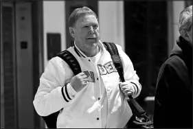  ?? ADAM HUNGER / AP ?? Mark Davis, owner of the Las Vegas Raiders, leaves the NFL owners meeting Wednesday in New York. Davis said he would like the league to release a written report of the NFL’S investigat­ion into the Washington Football Team, which wound up costing Raiders coach Jon Gruden his job.