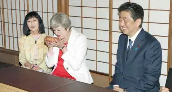  ?? — AFP ?? Prime Minister Theresa May takes part in a tea ceremony with Japanese Prime Minister Shinzo Abe (R) at Omotesenke Fushin’an in Kyoto, western Japan on Wednesday.