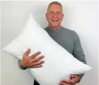  ??  ?? Alexander Miles, inventor of the Gx Pillow pictured with his invention