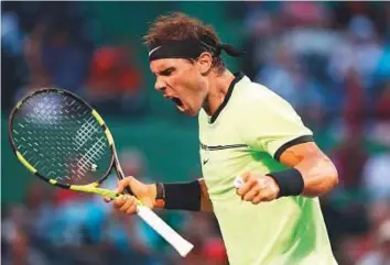  ?? AFP ?? Rafael Nadal of Spain celebrates after defeating Philipp Kohlschrei­ber of Germany at Crandon Park Tennis Center in Key Biscayne, Florida, on Sunday. The Spaniard won 0-6, 6-2, 6-3.