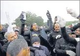  ?? REUTERS ?? World heavyweigh­t boxing champion Anthony Joshua (centre) at a n
Black Lives Matter protest in Watford, London, on Saturday.