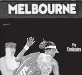  ?? Vincent Thian / Associated Press ?? Venus Williams acknowledg­es the crowd as she leaves Rod Laver Arena after losing 6-3, 7-5 to Switzerlan­d’s Belinda Bencic in the first round Monday.