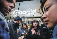  ?? TOLGA AKMEN / AFP / GETTY IMAGES ?? Google staff stage a walkout Thursday at the company’s U.K. headquarte­rs in London as part of a global campaign over the U.S. tech giant’s handling of sexual harassment allegation­s against its executives.