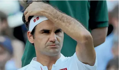  ?? AP ?? Roger Federer shows the strain during his loss to Kevin Anderson at Wimbledon yesterday.