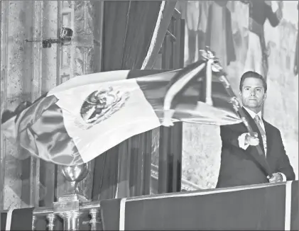  ?? Foto Afp ?? El presidente Enrique Peña Nieto durante la ceremonia del Grito de Independen­cia, la noche del viernes pasado