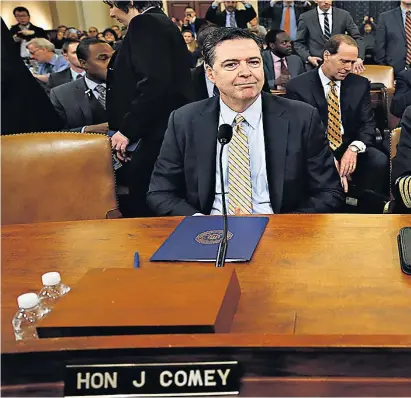  ??  ?? James Comey, the director of the FBI, and Mike Rogers, director of the National Security Agency, at the House Intelligen­ce Committee hearing into alleged Russian meddling in the 2016 US election