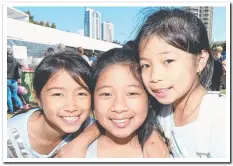  ??  ?? Alaysha Lacanlale, 8, Jazmin Enriquez, 11, and Felicity Enriquez, 9, enjoyed every minute of the festival.