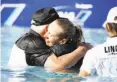  ?? Alex Gallardo / Associated Press ?? Pernilla Lindberg and her father (left) and fiance-caddie took a plunge after her victory.