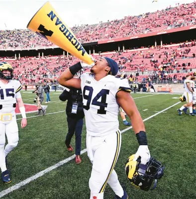  ?? BEN JACKSON/GETTY ?? Michigan’s Kris Jenkins celebrates a victory over the Ohio State on Saturday at Ohio Stadium in Columbus, Ohio.