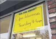  ?? Diego mendoza-moyers / times union ?? Signs outside of the Stewart’s Shop at Albany Shaker and everett road invite the public to apply for work at the convenienc­e store. Stewart’s starts employees at $12 an hour, higher than new York’s minimum wage in 2019, when it rises to $11.10.