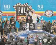  ?? Logan Riely/Getty Images ?? Kyle Busch celebrates in Victory Lane after winning the NASCAR Cup Series Pala Casino 400 at Auto Club Speedway on Sunday in Fontana, Calif.