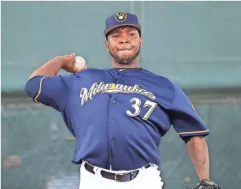  ?? ASSOCIATED PRESS ?? Pitcher Neftali Feliz takes part in his first workout with the Brewers on Monday. Feliz is expected to be the team’s primary closer after signing in the off-season for $5.35 million. He was a dominant reliever early in his career.
