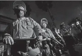  ?? Robert Gauthier Los Angeles Times ?? DEPUTIES STAND watch outside the South L.A. sheriff’s station on Aug. 31 as activists protest the fatal shooting of Dijon Kizzee by deputies in Westmont.