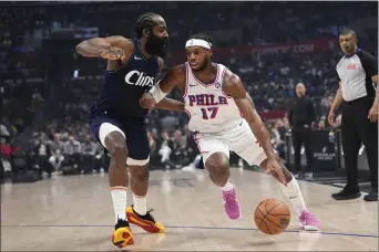  ?? JAE C. HONG — THE ASSOCIATED PRESS ?? Sixers guard Buddy Hield (17) drives past Los Angeles Clippers guard James Harden during the first half Sunday in Los Angeles.