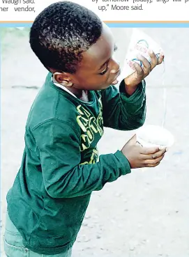  ?? LIONEL ROOKWOOD ?? This little boy tries to stop his snow cone from going to waste during a treat at the Boys’ Town Infant and Primary School in Kingston recently.