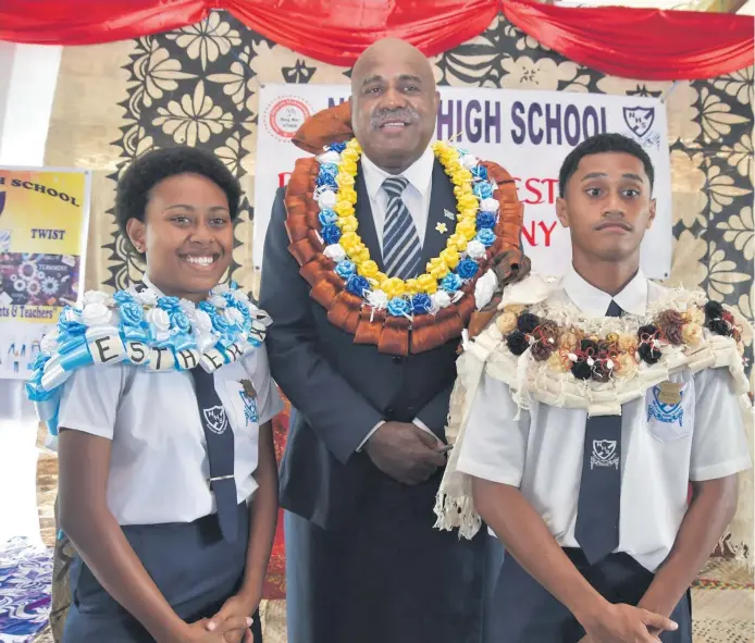  ?? Photo: SUPPLIED ?? Assistant Minister in the Office of the Prime Minister, Sakiusa Tubuna, with the newly badged head girl, Esther Kuva, and head boy, Pita Vosavakadu­a, after officiatin­g at the Prefect Investitur­e ceremony at Nakasi High School.