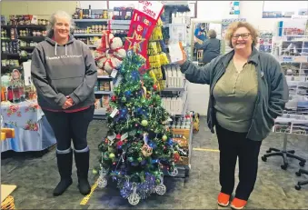  ??  ?? Bùth Bharraigh’s Fiona MacLean, right, pictured with Naomi Robarts who works in the shop.