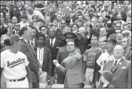  ?? AP File Photo ?? President Richard M. Nixon throws out the ceremonial first pitch in Washington on April 7, 1969 as Washington Senators manager Ted Williams (far left) watches.