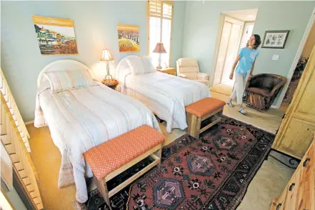  ?? NEW MEXICAN FILE PHOTOS ?? A home shopper tours a house on the market in Santa Fe in 2014. Area Realtors say for those looking to list their home in spring, now is the time to declutter, clean up and get an idea what needs to be repaired or upgraded.