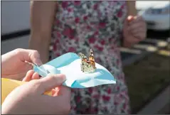  ?? COURTESY PHOTOGRAPH­S ?? Left: Lodi Community Outreach hosted a butterfly release event on Mother’s Day where Lodi residents could honor their lost loved ones. Below: Local artist Jun Jamosmos painted at the event.