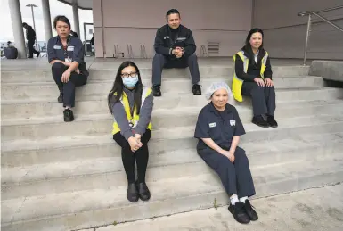  ?? Photos by Santiago Mejia / The Chronicle ?? Emily Wendler (left), Pearl Li, Nathanael Baquedano, Anna Lee and Yan Huan Chen are outside airline catering company GateGourme­t at San Francisco Internatio­nal Airport.