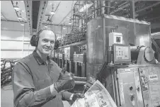  ?? BRUCE DEACHMAN ?? First pressman Ken Elliott gives the thumb’s up in the Ottawa Citizen/Sun press room. The presses were idle for almost 11 hours on Wednesday night and Thursday morning, marking the first time in at least four decades that a Citizen edition wasn’t delivered as scheduled.