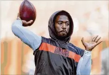  ?? JASON MILLER/GETTY IMAGES ?? Browns starting quarterbac­k Tyrod Taylor suffered a left hand injury with 6:05 left in the first quarter. After missing two series, he returned with 14:06 remaining in the second quarter.