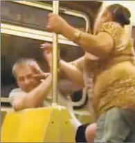  ?? NEWSFLARE ?? Video shows man cowering in his seat as a woman repeatedly slapped him on an R train.