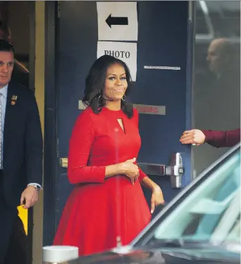  ?? ARLEN REDEKOP ?? Michelle Obama leaves the Queen Elizabeth Theatre on Thursday after speaking in Vancouver.