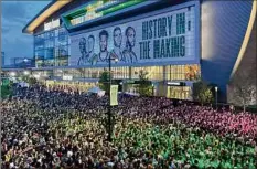  ?? Steve Megargee / Associated Press ?? Thousands of fans gathered outside Fiserv Forum to watch on a screen as Milwaukee played at Phoenix in Game 1.