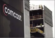  ?? Justin Sullivan / TNS ?? The Comcast logo is displayed on the exterior of a Comcast office on Jan. 23, in San Francisco.