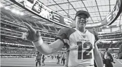  ?? AP ?? Cardinals quarterbac­k Colt McCoy walks off the field after a win over the Rams on Sunday in Inglewood, Calif.