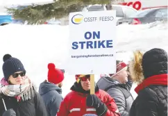  ?? John Lapa / postmedia news files ?? Teachers and staff represente­d by the Ontario Secondary School Teachers’ Federation took part in a one- day strike in Sudbury on Feb. 28. just a few weeks before lockdown.