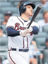  ?? CURTIS COMPTON TRIBUNE NEWS SERVICE FILE PHOTO ?? It was a perfect off-season for Freddie Freeman. He won the Hank Aaron Award and was also named NL MVP, but the best part was the birth of his two sons.