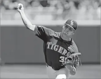  ?? NATI HARNIK/AP PHOTO ?? LSU pitcher Alex Lange delivers a pitch during the third inning of Friday’s game against Oregon State in the College World Series at Omaha, Neb.