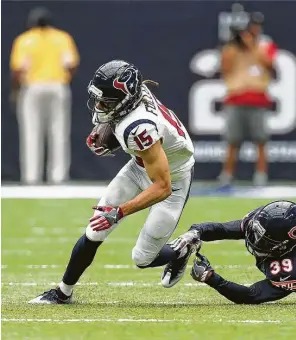  ??  ?? Texans receiver Will Fuller, left, gains yardage against Bears cornerback Jacoby Glenn in te season opener. Buoyed by the good start, the rookie leads the team in catches with 19.