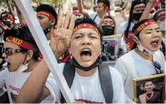  ?? SIRACHAI ARUNRUGSTI­CHAI
GETTY IMAGES ?? Activists shout while attending the anti Myanmar Junta demonstrat­ion in front of the United Nations building on in Bangkok.