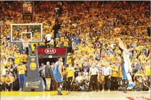  ??  ?? Stephen Curry of the Golden State Warriors shoots a three-pointer against the Oklahoma City Thunder in the playoffs on May 30.