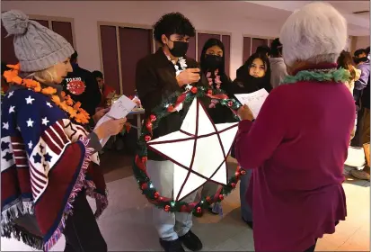  ?? PHOTOS BY CHRIS RILEY — TIMES-HERALD ?? Judges take a close look at the lantern created by Sergio Hernandez and his team during the Jesse Bethel Parol Festival and Competitio­n on Thursday in Vallejo.