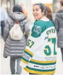  ?? CARLOS OSORIO/TORONTO STAR ?? Andrea Gmyrek wears a jersey to honour the Broncos at the Eaton Centre.